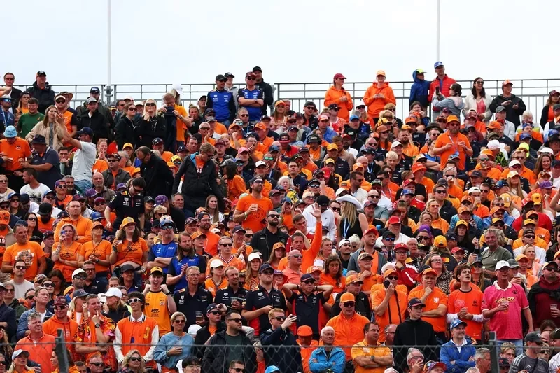 Fans in orange fill the grandstand