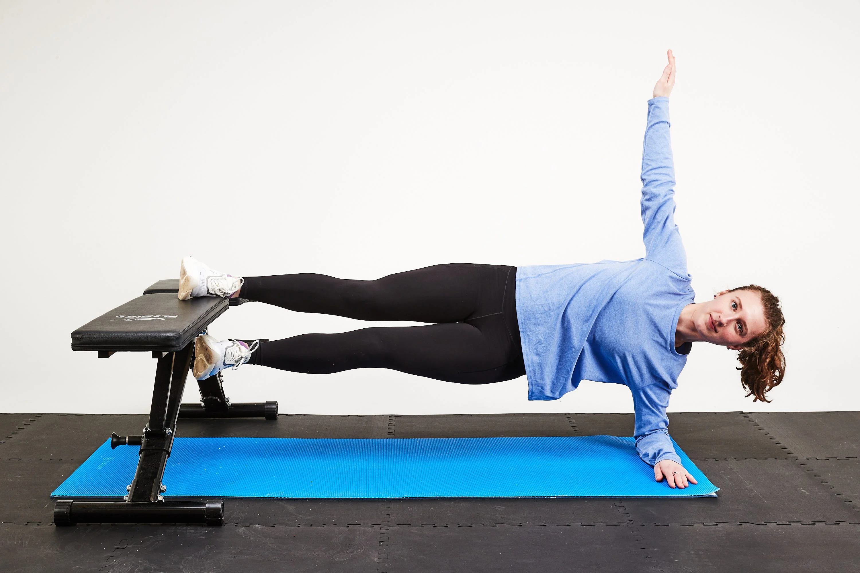 person doing a copenhagen side plank
