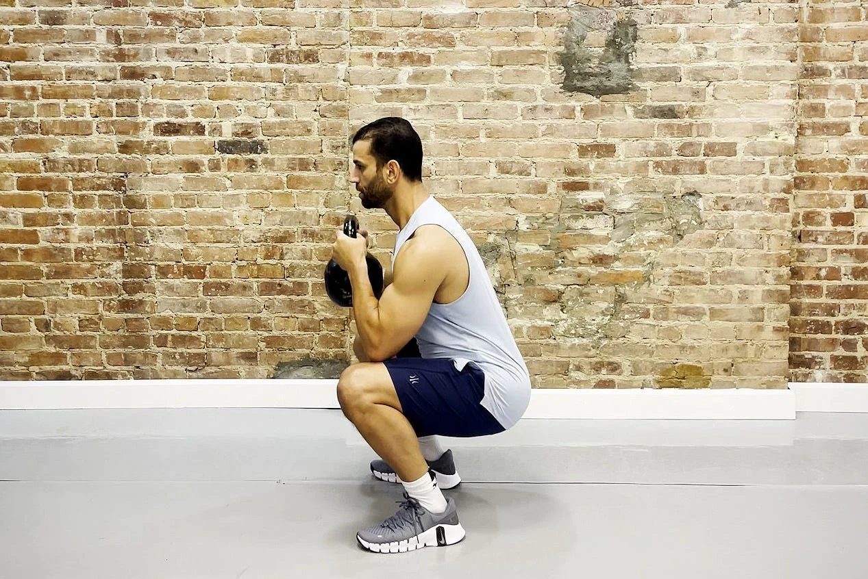 tamir practicing the goblet squat exercise