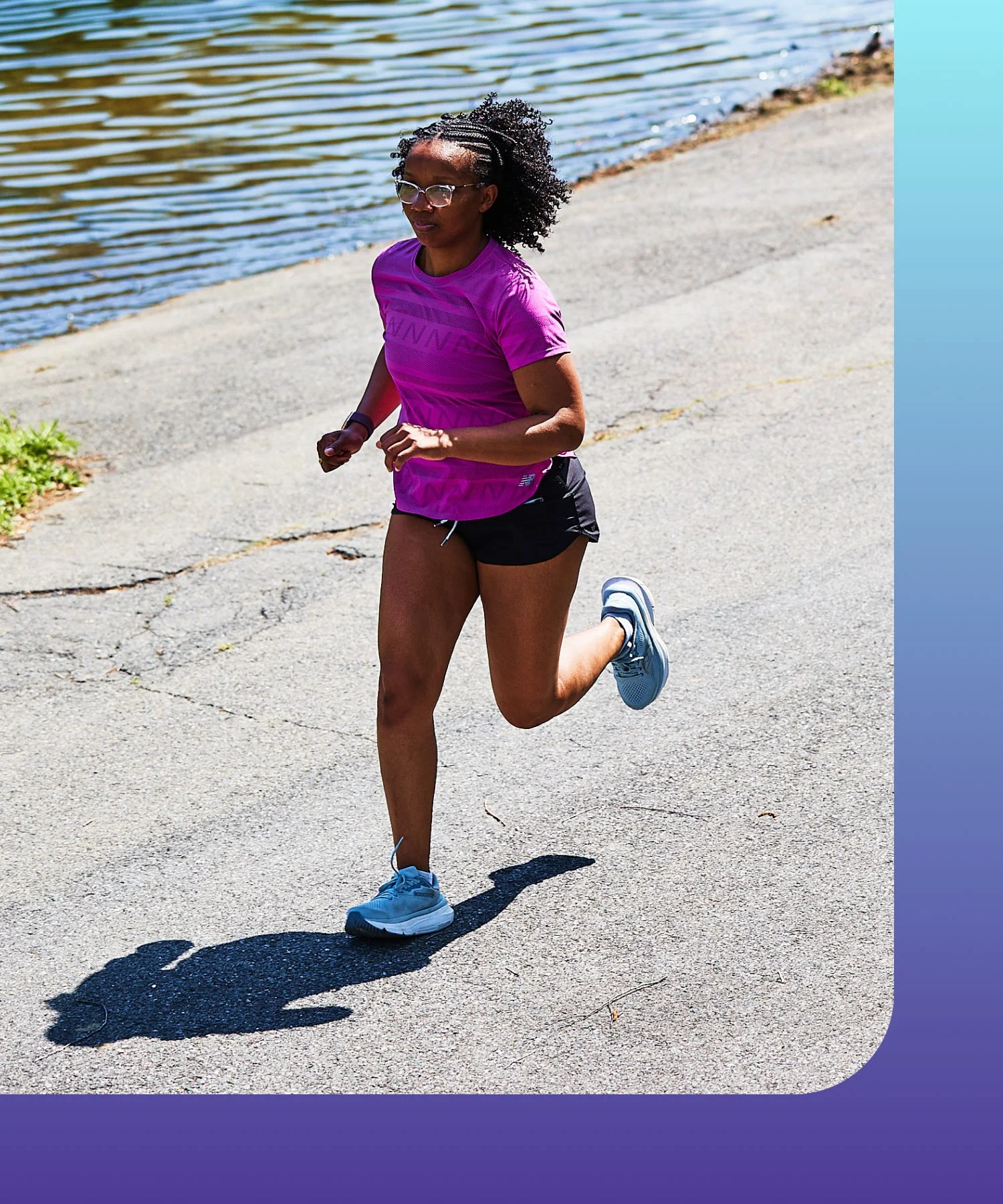 Person jogging along a waterfront path.