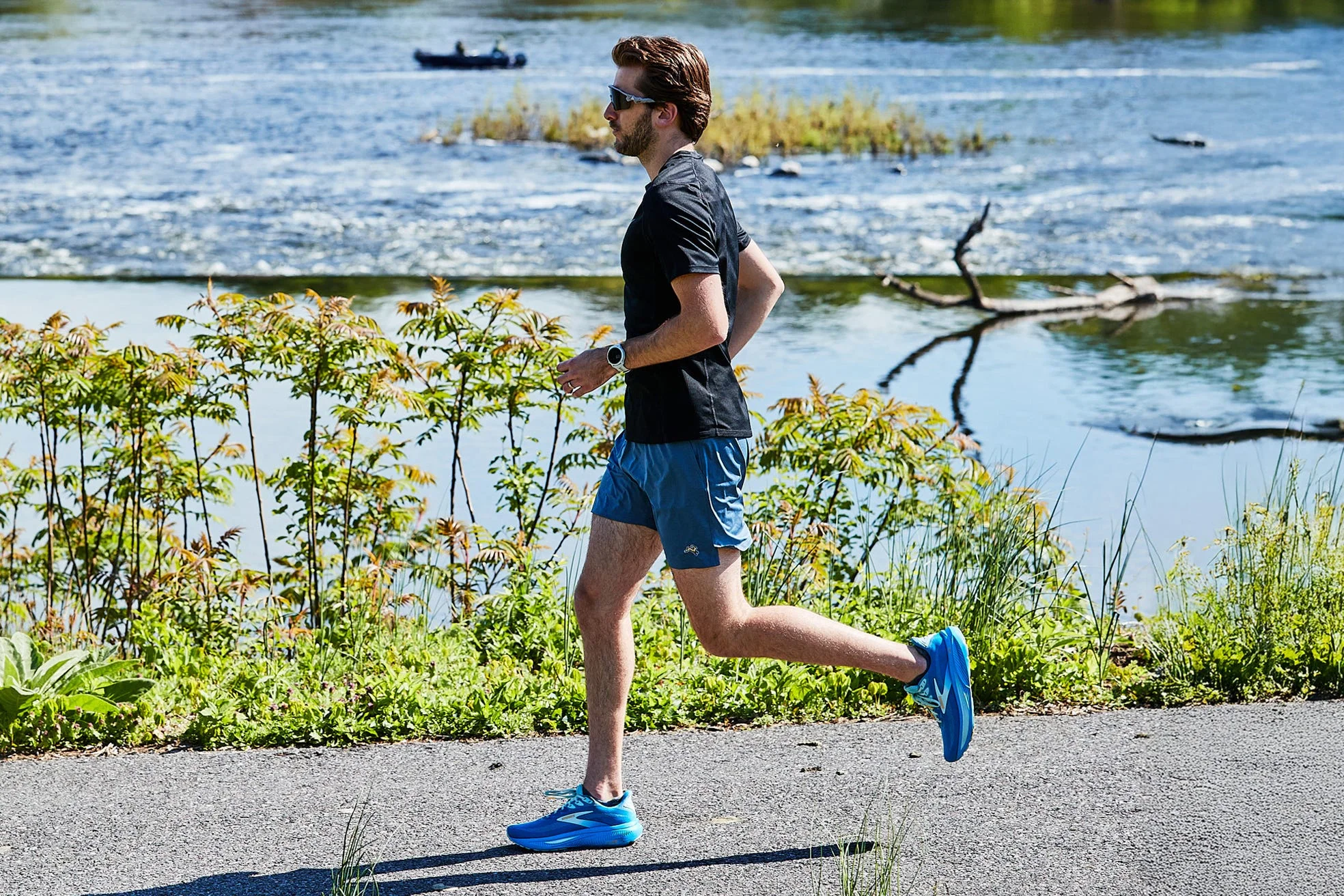 runner on riverside path