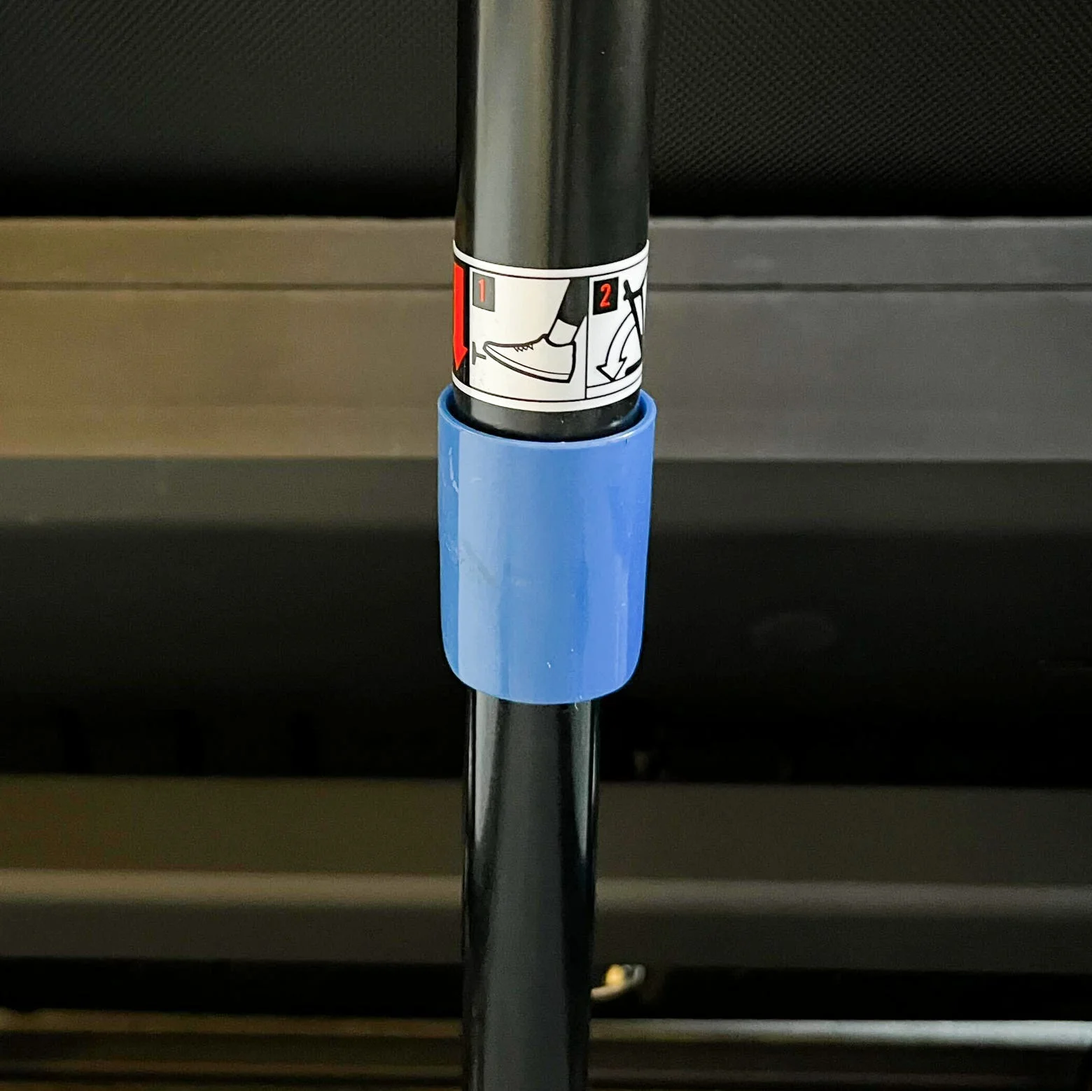 Adjustable pole with instructional graphics for usage