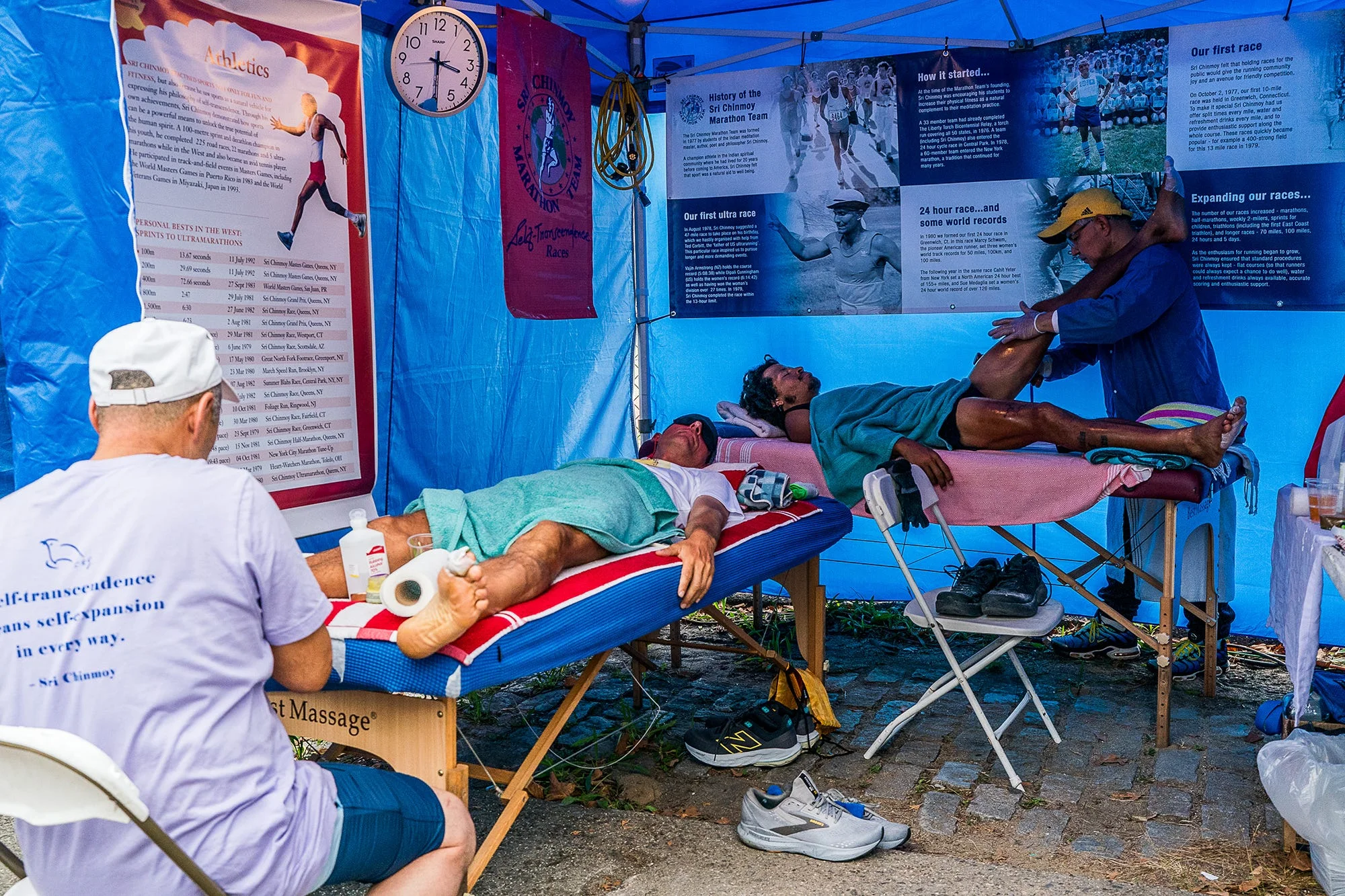 RWD milan javornicky’s l and alex ramsey are treated by medical staff during the sri chinmoy 3100 mile race in queens, new york on september 24, 2025 the race circles a high school over the corse of 2 months for 3100 miles